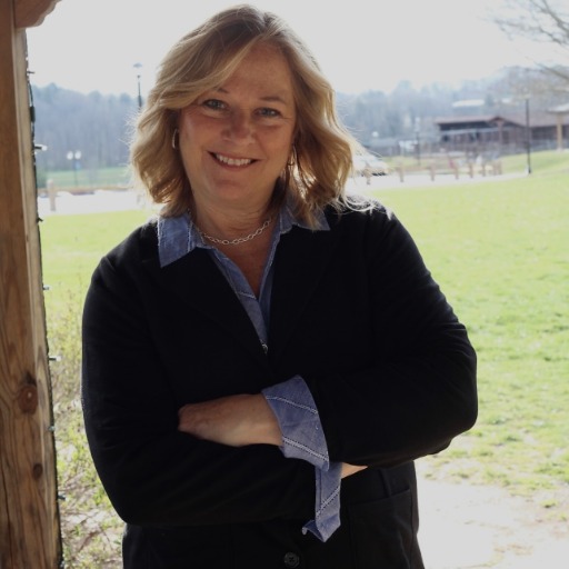 Kim Mannine smiling outdoors